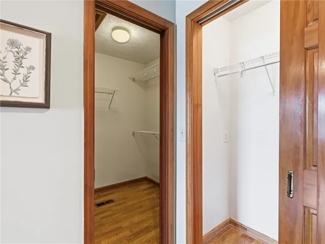 Two closets offer great storage with easy-care wire shelving systems in place.