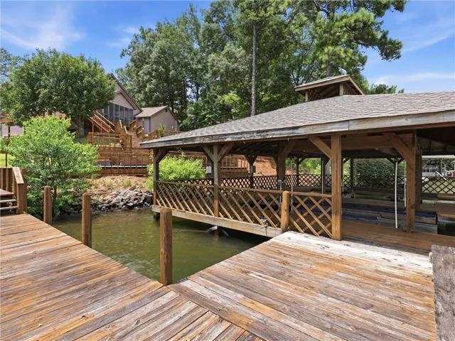 Boathouse with covered slips offers direct water access and relaxation.  The electrics at the boathouse were redone in Spring of 2026.