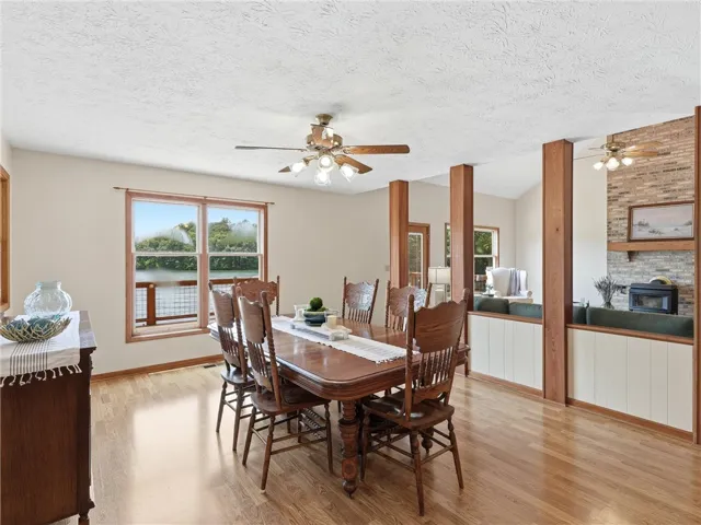 Dine with a view, as this welcoming room features a waterside window and entry to the screened in back porch.