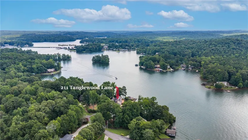Discover this private lakefront retreat, nestled amidst lush forests with tranquil water views.  Located inside Stillwaters, it's very convenient to Blue Creek by land or by boat.