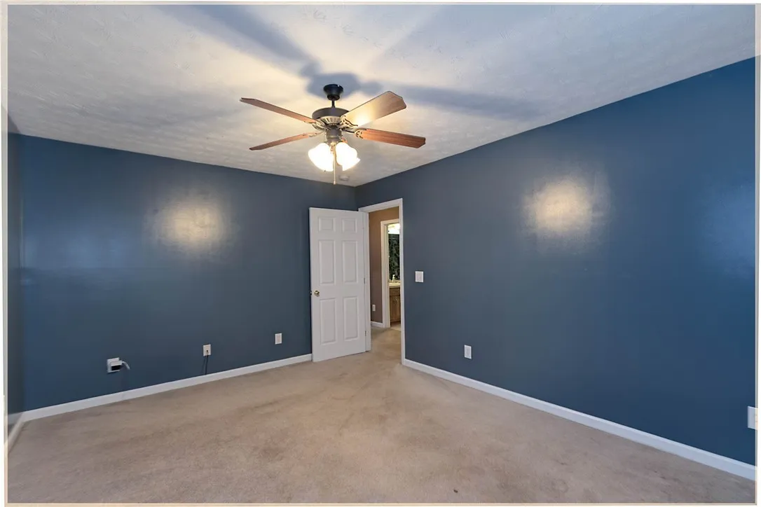 A well-lit bedroom provides comfortable living space.