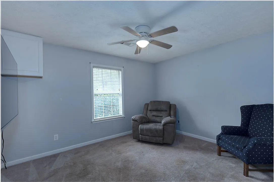 Well-lit room provides a comfortable space.