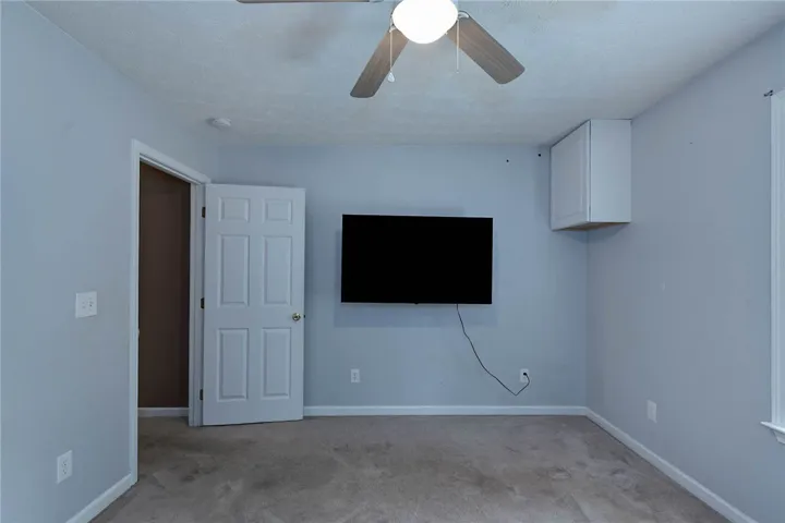 A well-proportioned bedroom with ample space for relaxation and personal touches.