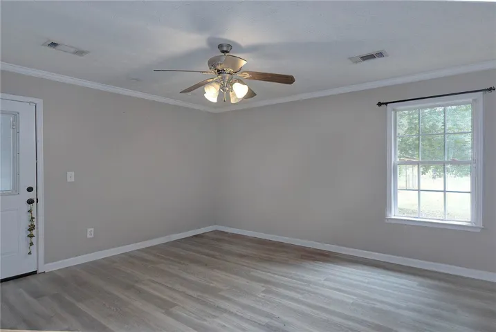 Well-maintained flooring and a bright window create an inviting atmosphere.