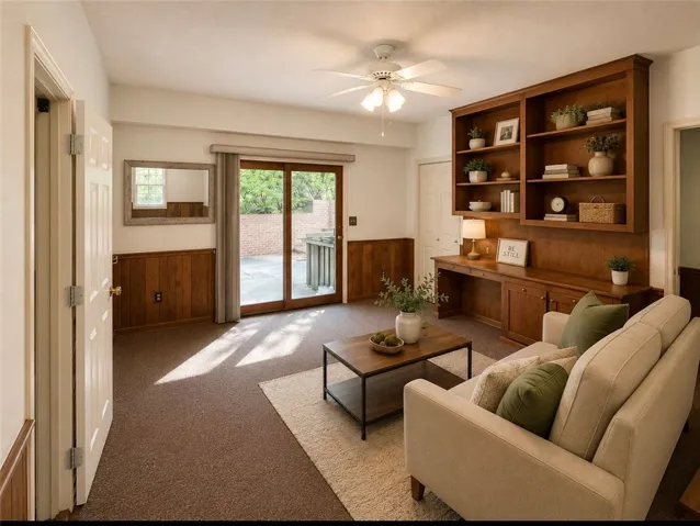 Built-in shelving and desk combine for a functional and elegant living area.