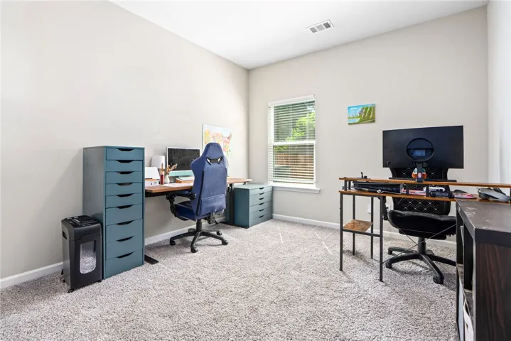 An inviting office space with a window offering natural light, perfect for productivity.