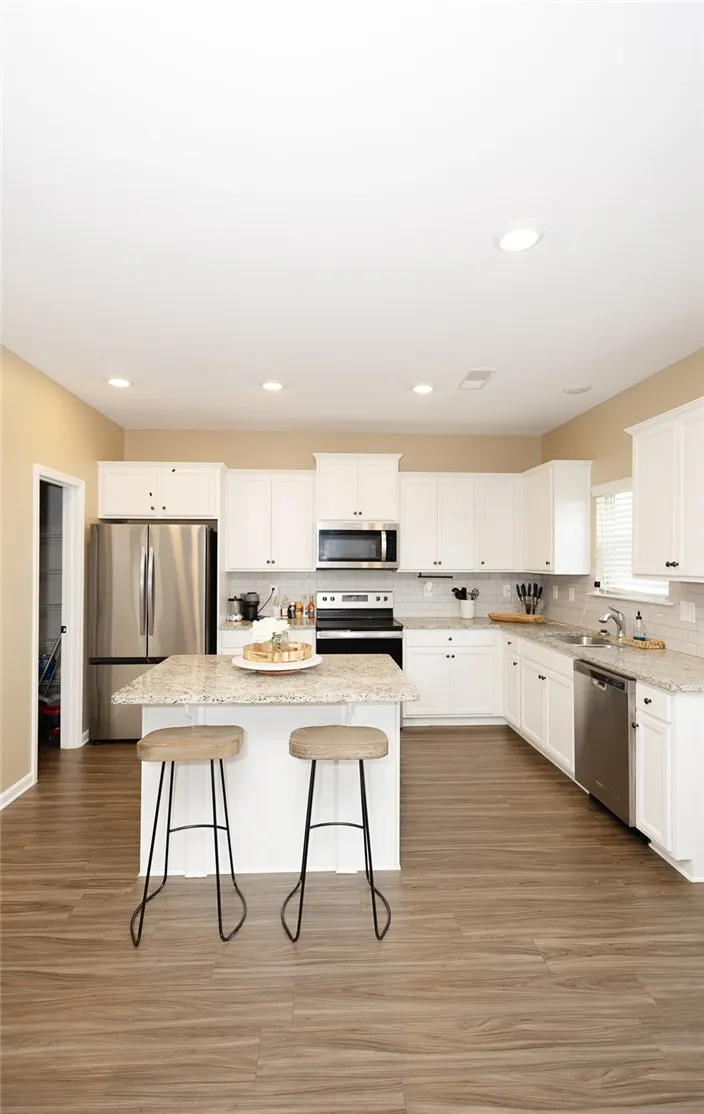 Culinary creations come alive in this well-appointed kitchen featuring a functional center island.