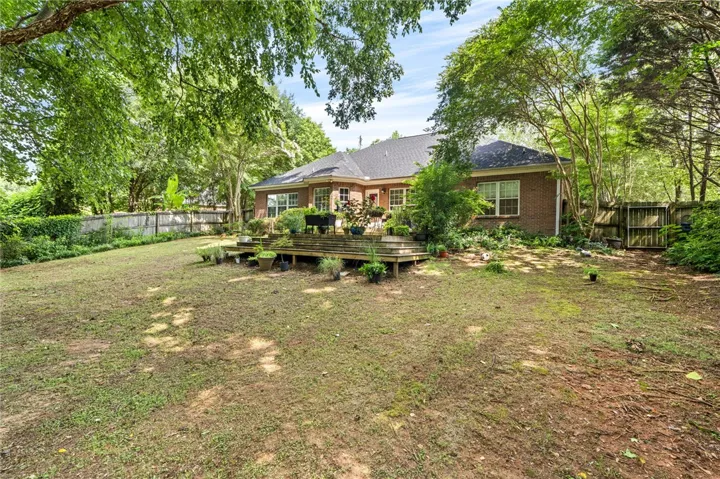 A spacious backyard featuring a generous deck perfect for outdoor enjoyment.