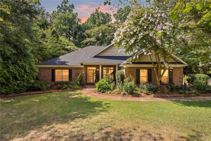 Timeless brick architecture nestled amidst verdant landscaping.