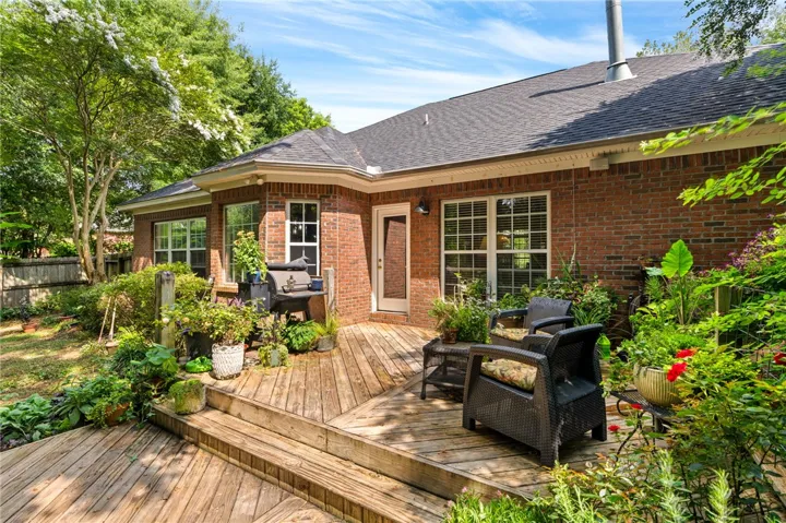 A spacious backyard featuring a generous deck perfect for outdoor enjoyment.