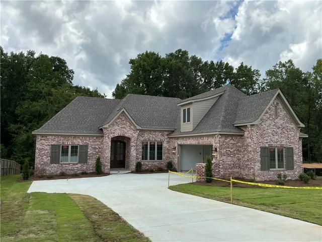 A striking brick facade welcomes you to this newly constructed home with a spacious driveway.