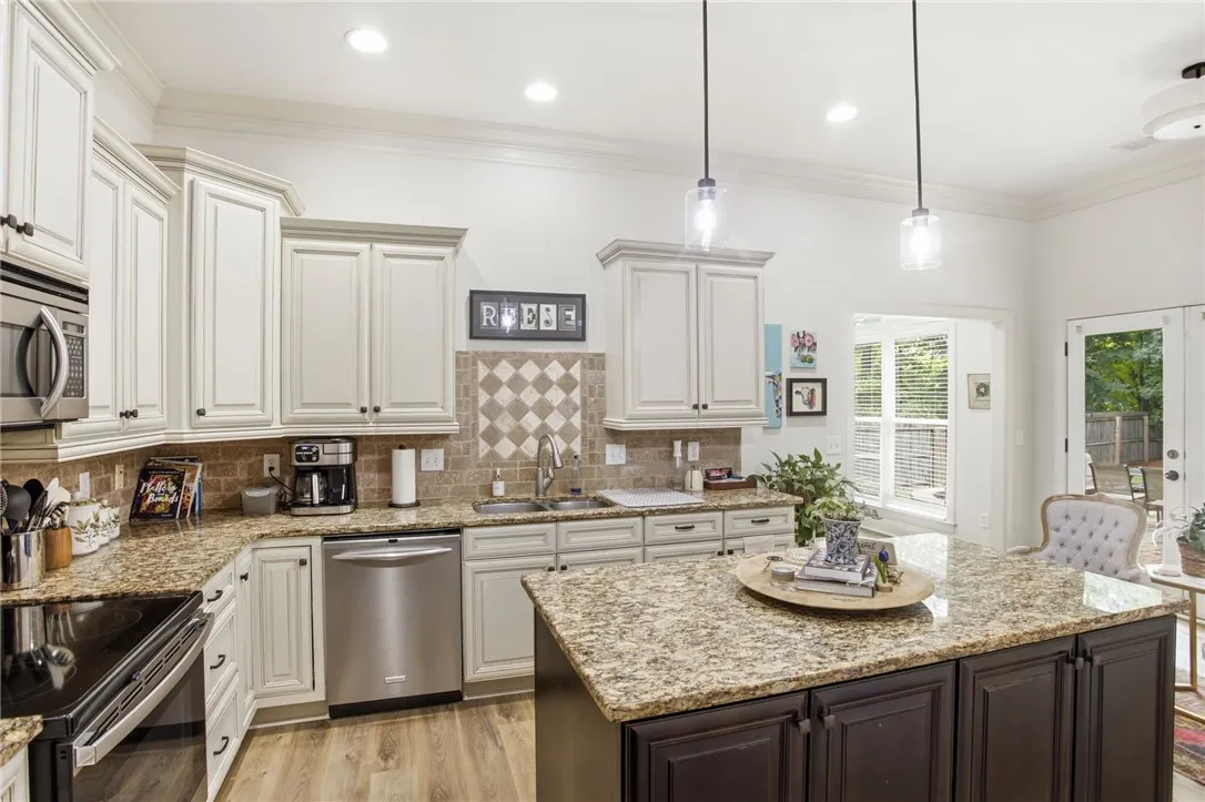 A well-appointed culinary space featuring ample counter and cabinet storage.