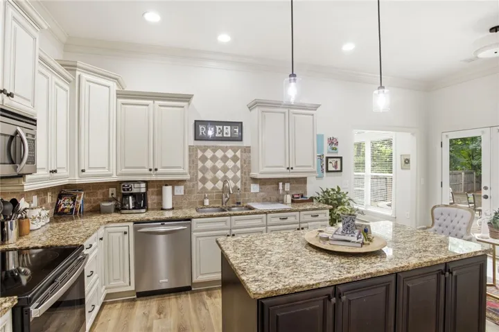 A well-appointed culinary space featuring ample counter and cabinet storage.