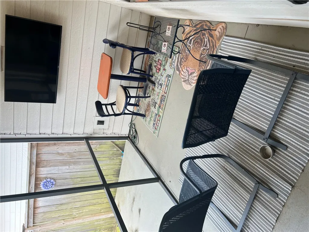Custom screened patio provides an ideal space for outdoor relaxation and entertainment.