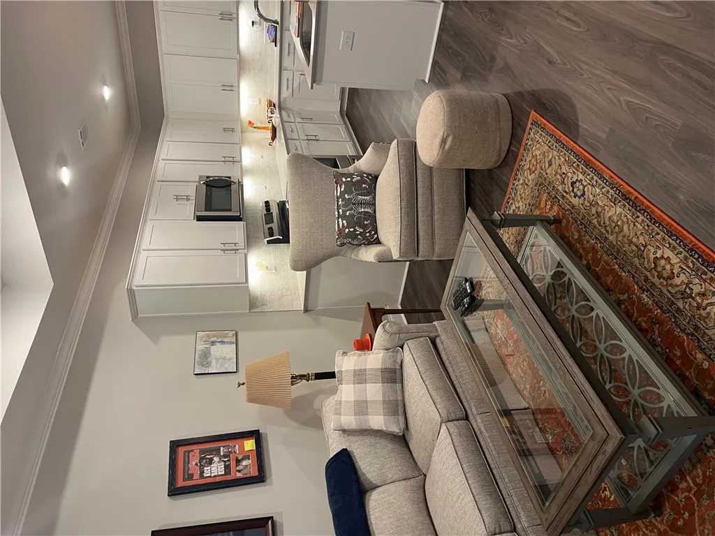 An open-concept living space ,a lighted trey ceiling and a contemporary kitchen flows seamlessly into the comfortable family area.