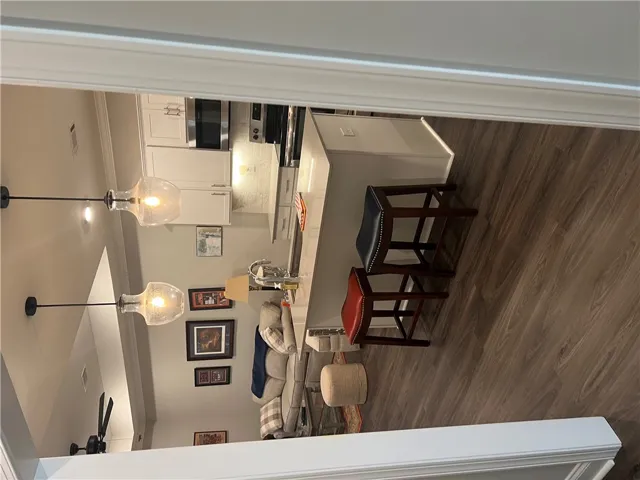 An open-concept layout connects the well-appointed kitchen to a comfortable living area, perfect for entertaining.