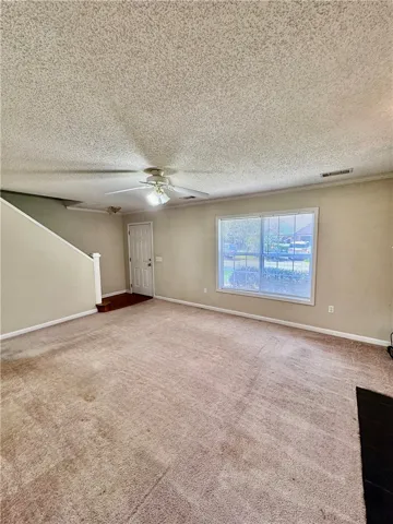 A well-lit living area awaits, offering a comfortable space for everyday living.
