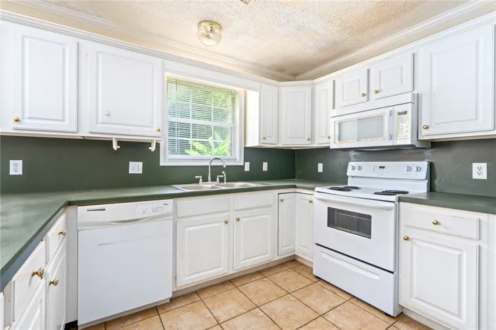 Functional kitchen with ample cabinetry and a practical layout for daily meal preparation.