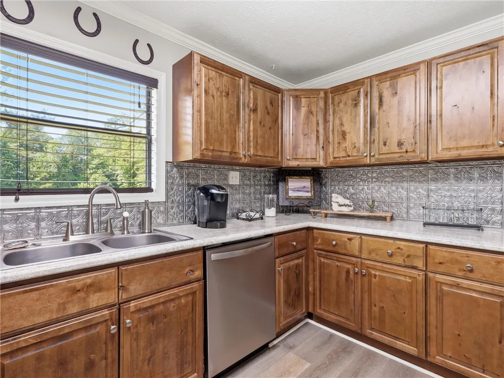 A well-appointed kitchen features ample cabinetry, durable countertops, and sleek appliances.
