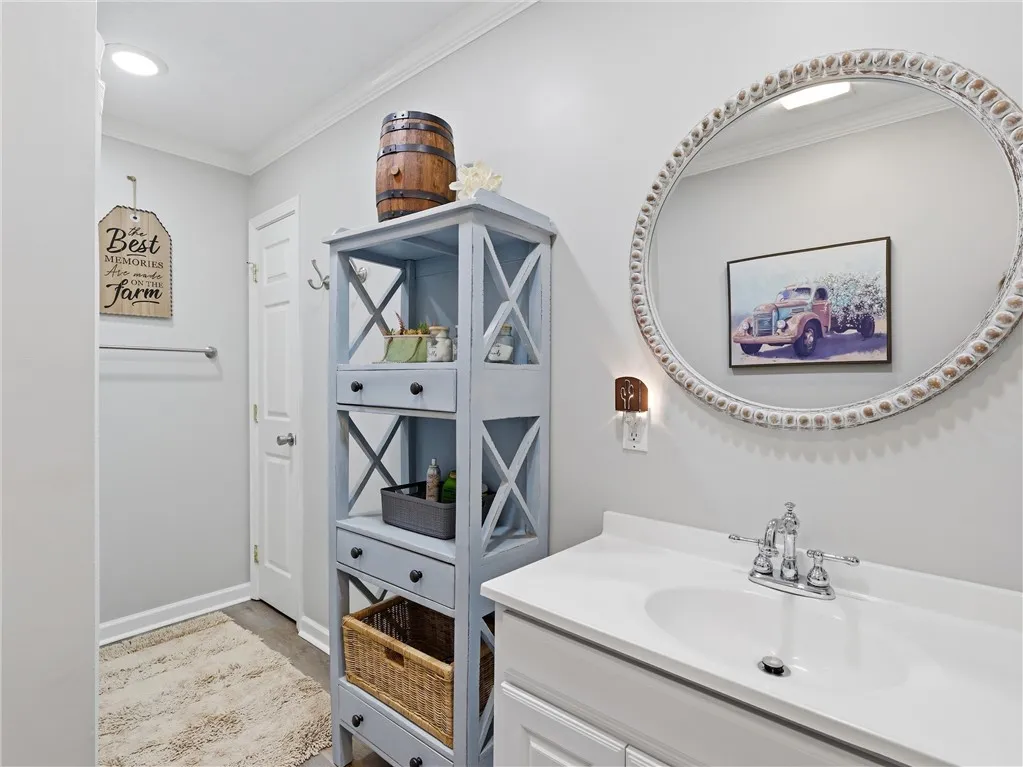 A well-appointed bathroom vanity features a broad mirror, offering both utility and visual appeal.