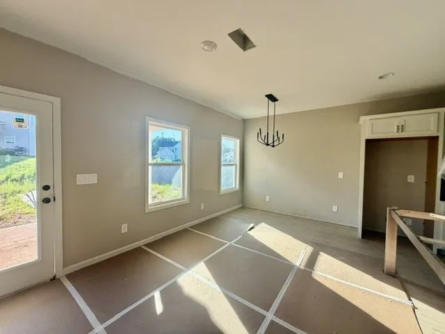 Natural light pours into this open-concept dining area, awaiting your personal touch.