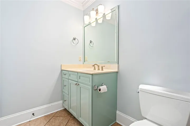 A chic vanity with a light blue cabinet and ample counter space for daily routines.
