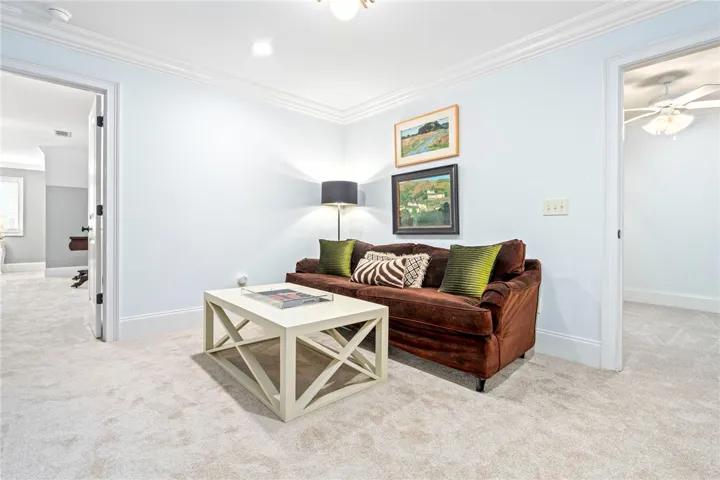 Crisp white walls and crown molding define this versatile bonus room.