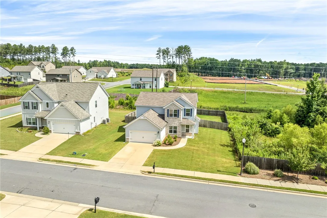 Two charming homes showcase well-maintained lawns and easy-access driveways within a pleasant neighborhood setting.