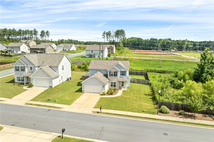 Two charming homes showcase well-maintained lawns and easy-access driveways within a pleasant neighborhood setting.