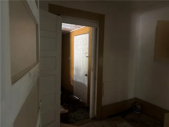 A glimpse into a dim hallway, hinting at hidden potential behind every doorway.