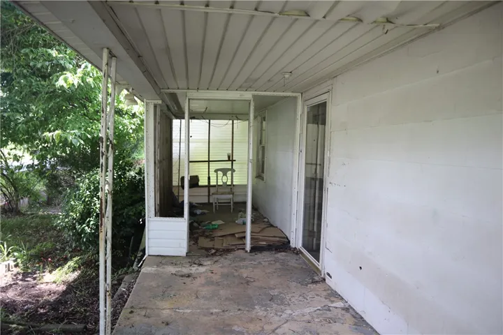 A deep covered patio offers shade and an inviting entry.