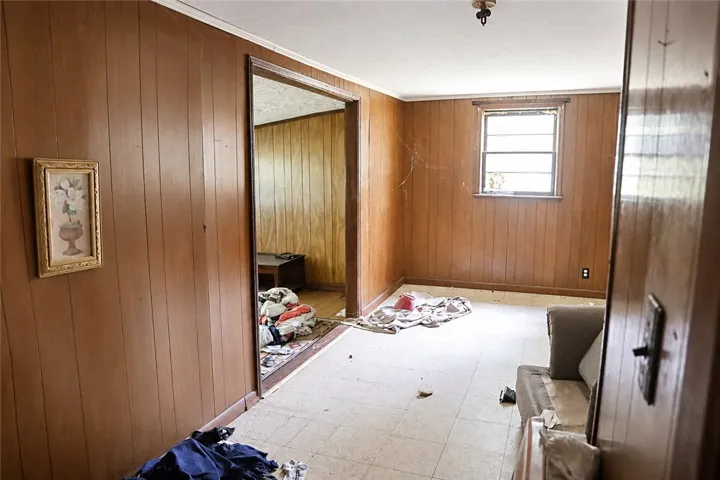 A promising interior space, offering an open floorplan and a classic window for natural light.