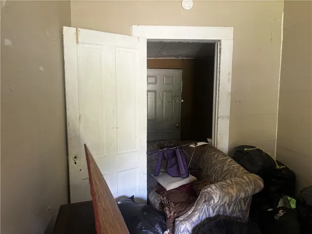 An interior door, partially open, offers a glimpse into an adjacent space within this room.