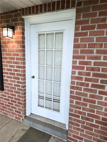 A classic brick exterior with a welcoming entryway.