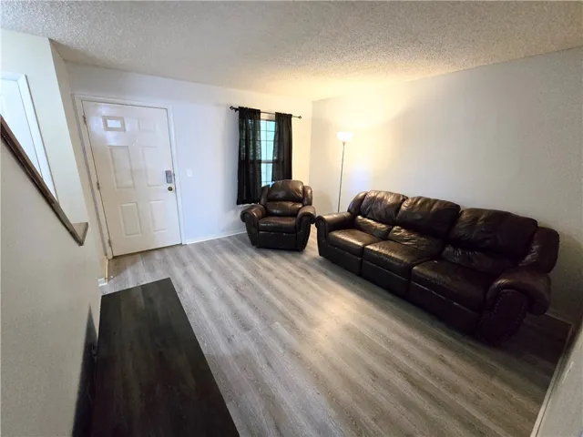 Clean-lined living space with durable flooring offers a welcoming entry.