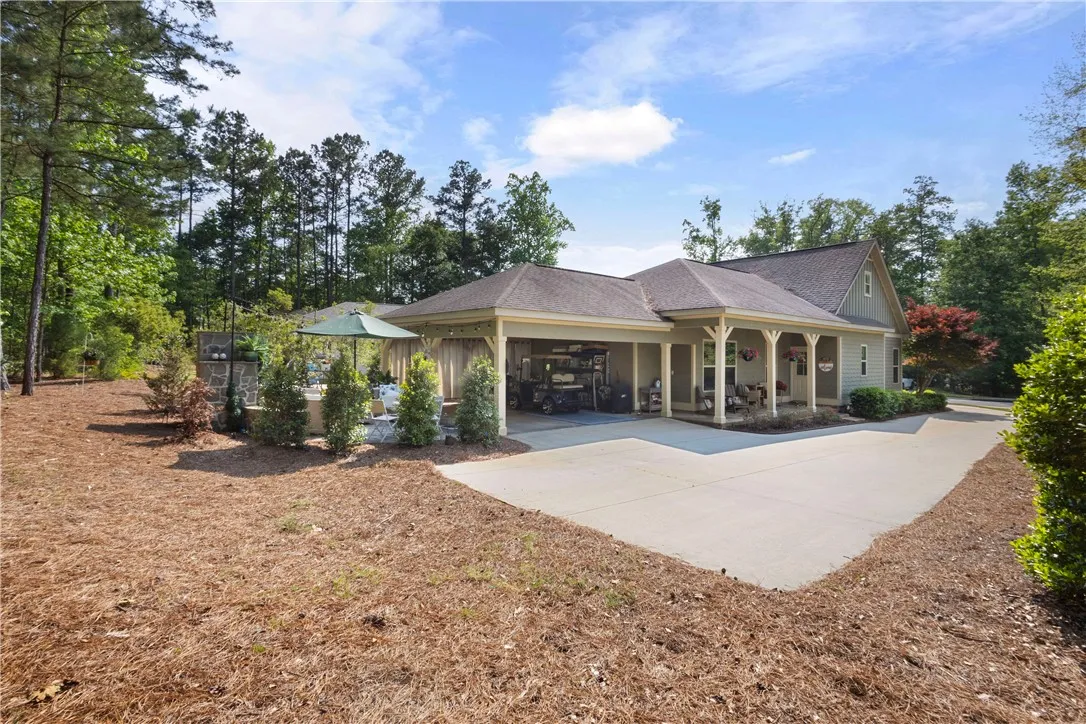 A welcoming front porch and convenient covered parking complement this inviting residence.