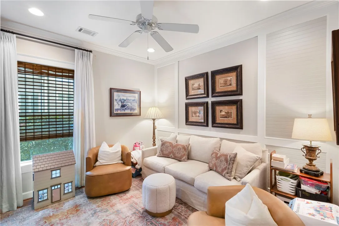 Comfortable furnishings and architectural wall details create a welcoming living space.