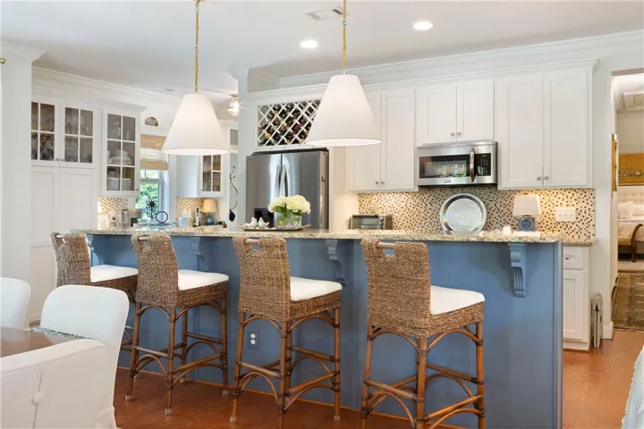 A well-lit kitchen with a spacious island for casual dining and entertaining.