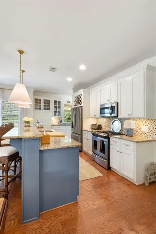 Culinary haven with granite counters, modern appliances, and a stylish island.