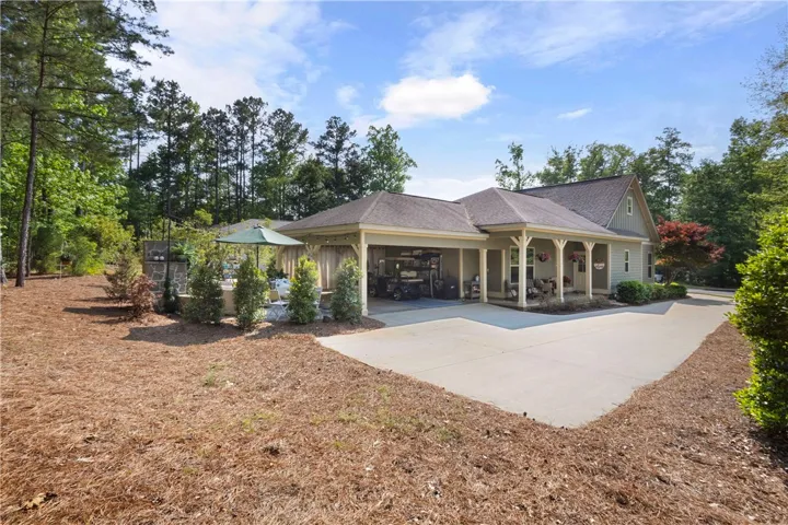 A welcoming front porch and convenient covered parking complement this inviting residence.