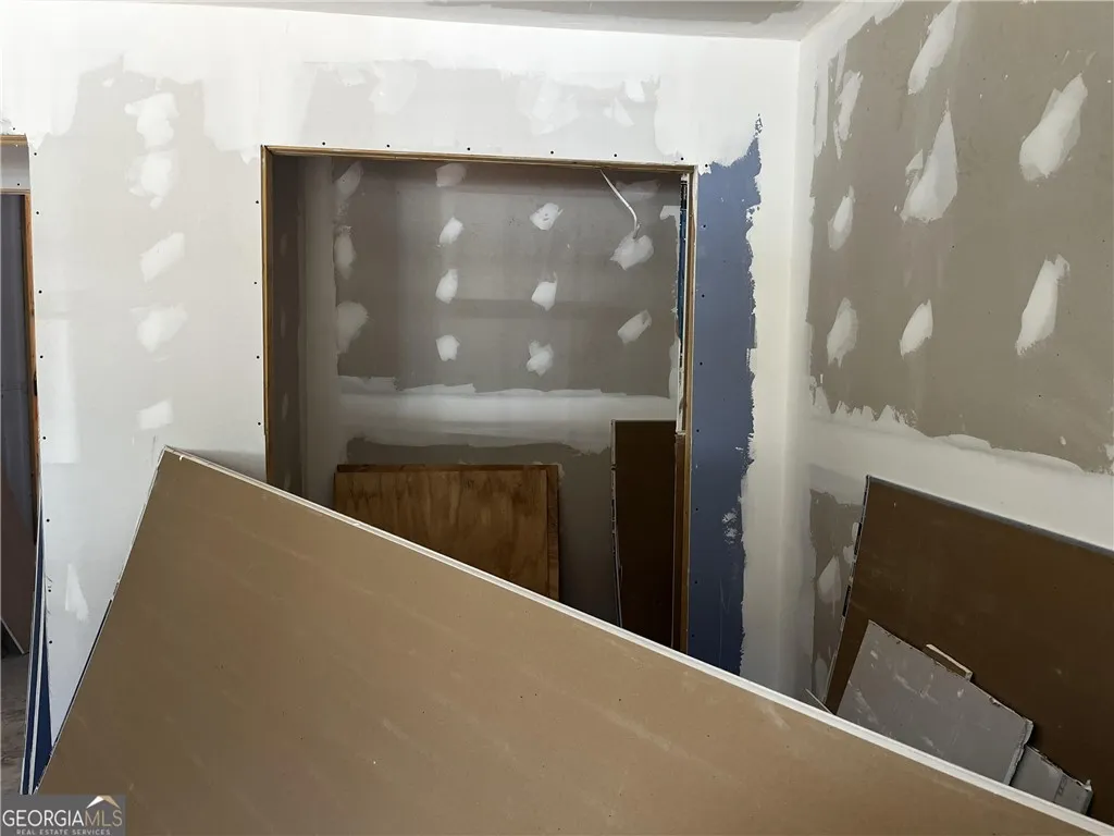 Building materials await installation in a room primed for completion.