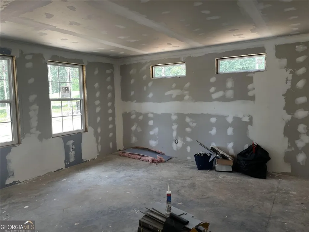 A room in the midst of construction, awaiting its final finishes to reveal its full potential.