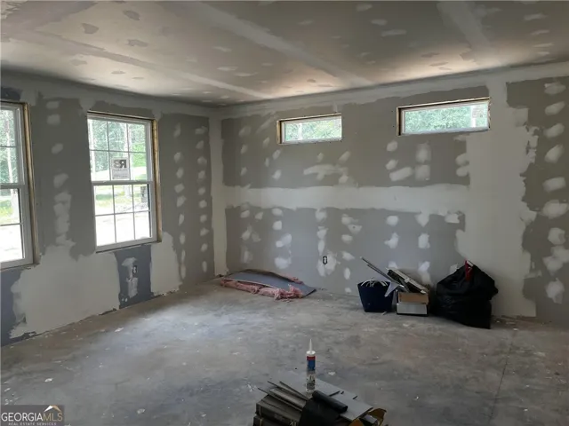 A room in the midst of construction, awaiting its final finishes to reveal its full potential.