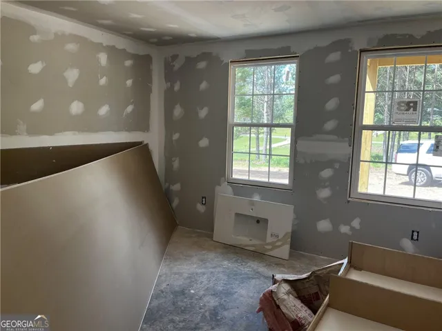 Newly framed windows let in ample light, creating a bright space ready for finishing touches.