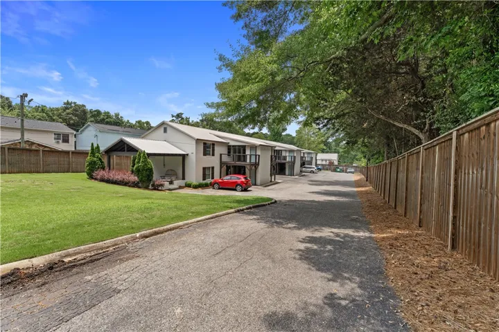 A quiet residential street with abundant green space leads to this charming multi-unit property.
