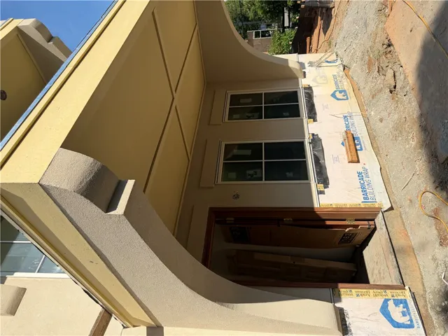 Bold architectural lines define this striking residential facade, hinting at modern design within.