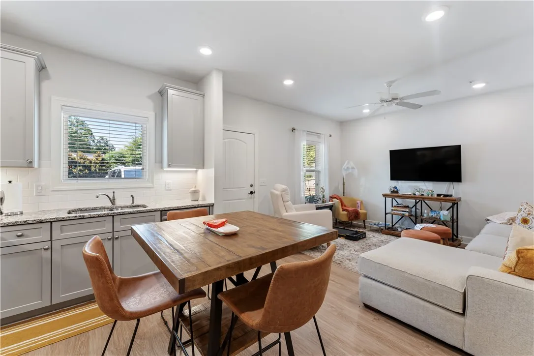 An open-concept living space integrates a well-appointed kitchen with inviting entertainment areas.