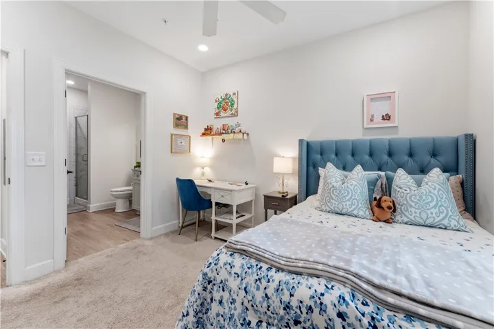 Well-lit sleeping quarters with a dedicated work area and private bath access.