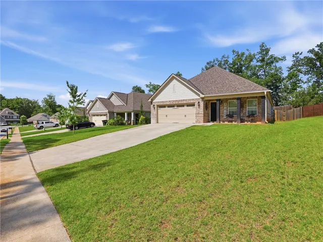 A well-maintained lawn welcomes you to this inviting neighborhood residence.
