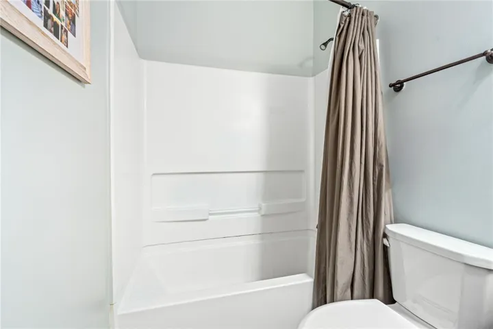 Functional bath with shower, a serene space for daily refreshing.